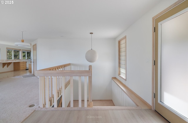 213 University Ave, Manzanita, OR 97130 - corridor with carpet flooring and an upstairs landing