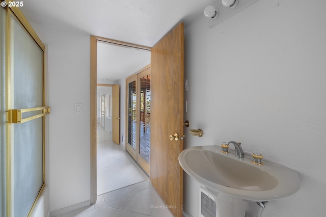 213 University Ave, Manzanita, OR 97130 - bathroom with a sink and tile patterned floors