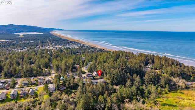 213 University Ave, Manzanita, OR 97130 - drone / aerial view featuring a water view and a view of the beach