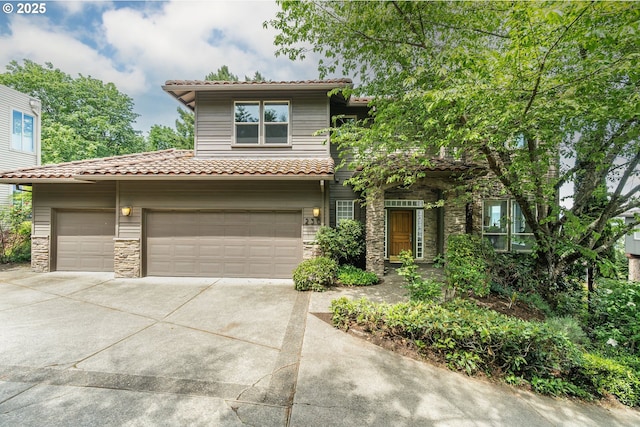 230 SW Florida St, Portland, OR 97219 - view of front of property with stone siding, driveway, and a tiled roof