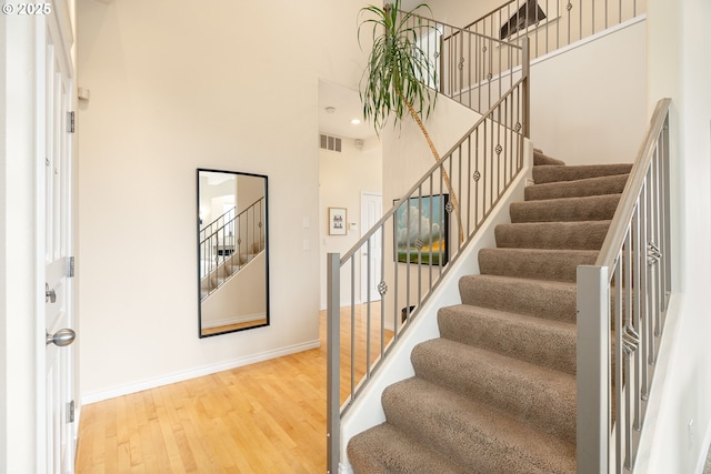 230 SW Florida St, Portland, OR 97219 - entryway featuring a towering ceiling, stairway, and wood finished floors