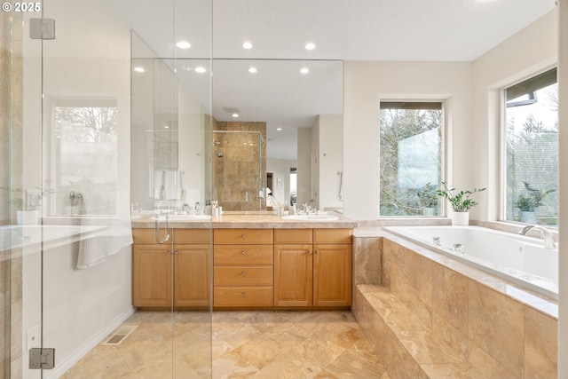 230 SW Florida St, Portland, OR 97219 - full bath with a shower stall, double vanity, a garden tub, and recessed lighting