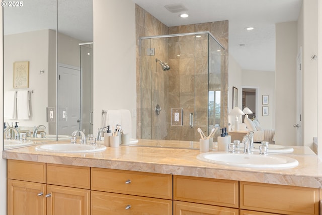 230 SW Florida St, Portland, OR 97219 - full bathroom featuring a shower stall, double vanity, and recessed lighting