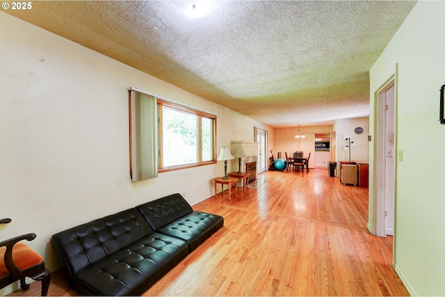 6620 SE Barbara Welch Rd, Portland, OR 97236 - living room with a textured ceiling and light wood-style floors