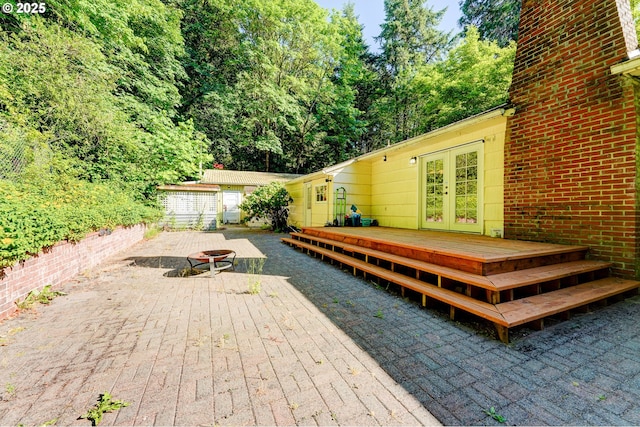 6620 SE Barbara Welch Rd, Portland, OR 97236 - deck featuring an outdoor fire pit and french doors