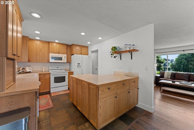 1941 NE 143rd Ave, Portland, OR 97230 - kitchen featuring white appliances, light countertops, open shelves, recessed lighting, and a textured ceiling