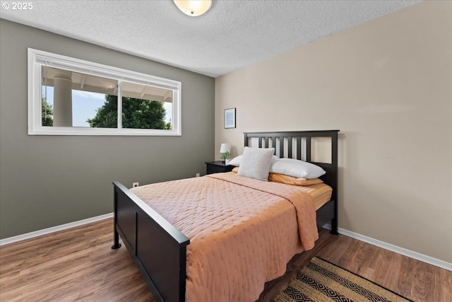 1941 NE 143rd Ave, Portland, OR 97230 - bedroom featuring wood finished floors and a textured ceiling