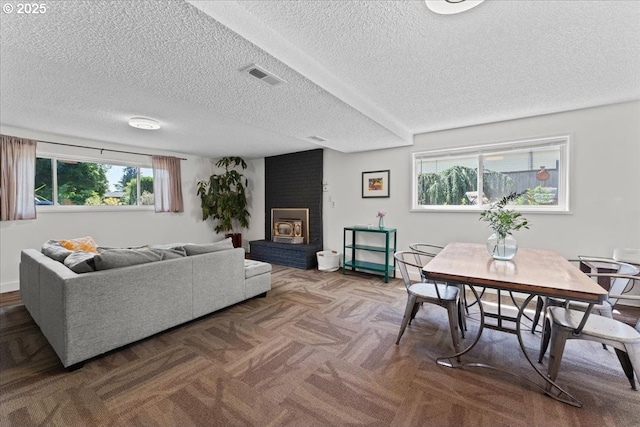 1941 NE 143rd Ave, Portland, OR 97230 - carpeted living area featuring a textured ceiling and a brick fireplace