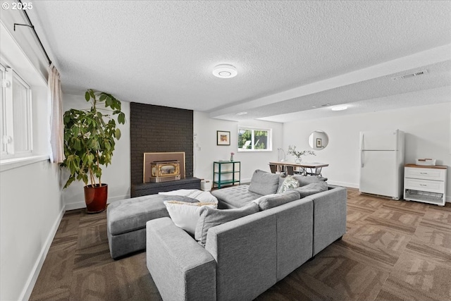1941 NE 143rd Ave, Portland, OR 97230 - living area featuring a textured ceiling and a brick fireplace