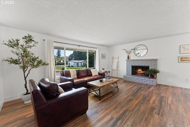 1941 NE 143rd Ave, Portland, OR 97230 - living room with wood finished floors, a textured ceiling, and a fireplace