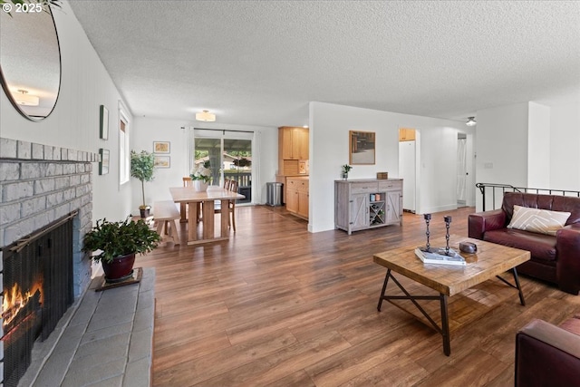 1941 NE 143rd Ave, Portland, OR 97230 - living area with a brick fireplace, a textured ceiling, and wood finished floors