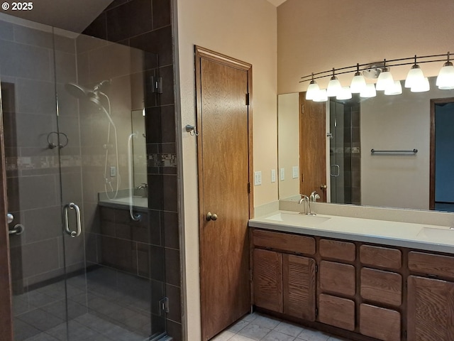 bathroom with vanity, walk in shower, and tile patterned floors