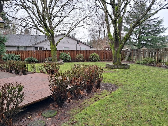 view of yard with a wooden deck