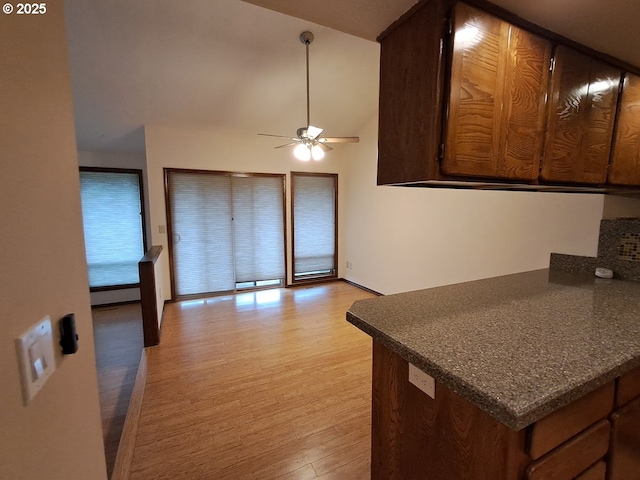 kitchen with light wood-type flooring and ceiling fan