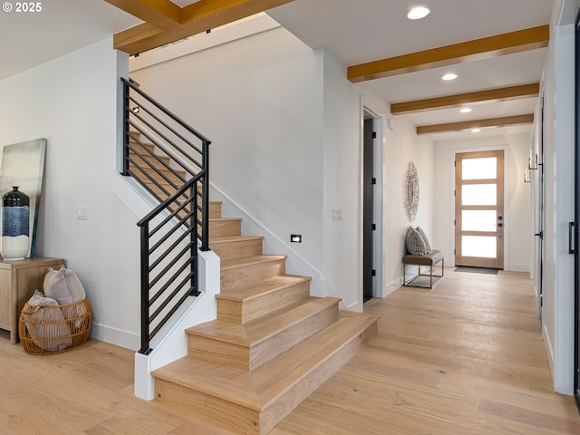 entryway featuring recessed lighting, stairway, beam ceiling, and light wood finished floors