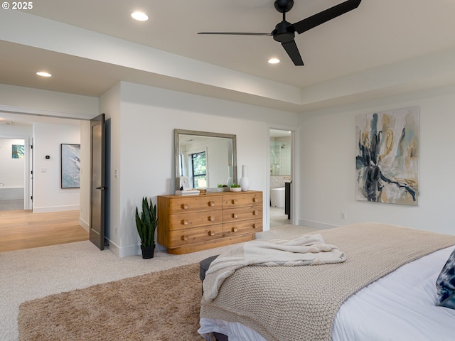 bedroom featuring baseboards, ceiling fan, light colored carpet, recessed lighting, and ensuite bathroom