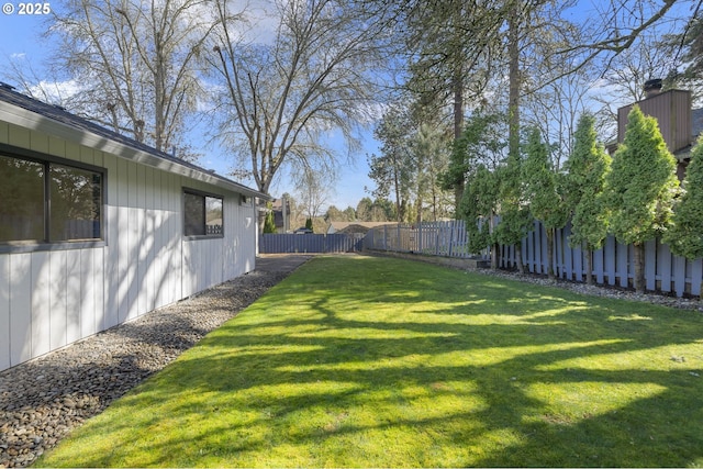 view of yard with a fenced backyard