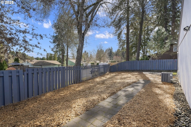 view of yard featuring cooling unit and a fenced backyard