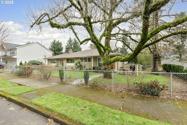 ranch-style house featuring a fenced front yard and a chimney