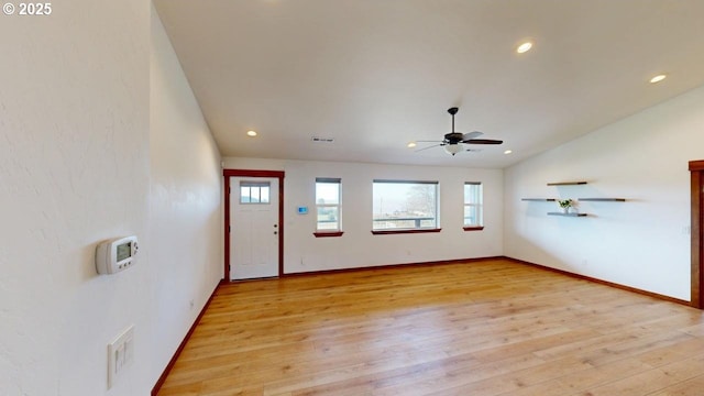 foyer entrance featuring lofted ceiling, recessed lighting, light wood finished floors, visible vents, and ceiling fan