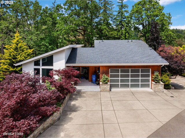 1311 NW 5th Ave, Camas, WA 98607 - view of front facade featuring driveway, roof with shingles, a garage, and a porch