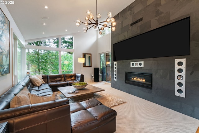 1311 NW 5th Ave, Camas, WA 98607 - living area featuring a chandelier, a tile fireplace, carpet floors, a high ceiling, and recessed lighting