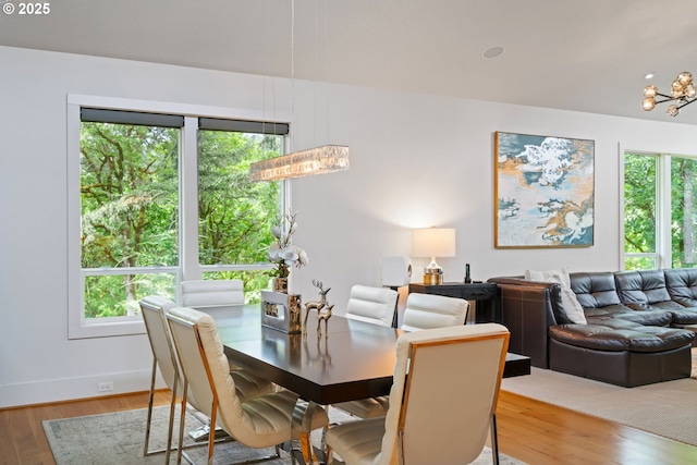 1311 NW 5th Ave, Camas, WA 98607 - dining area featuring wood finished floors, baseboards, and a chandelier