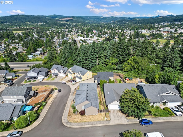 1590 Cottage Heights Loop, Cottage Grove, OR 97424 - aerial view of property's location featuring nearby suburban area and a mountainous background