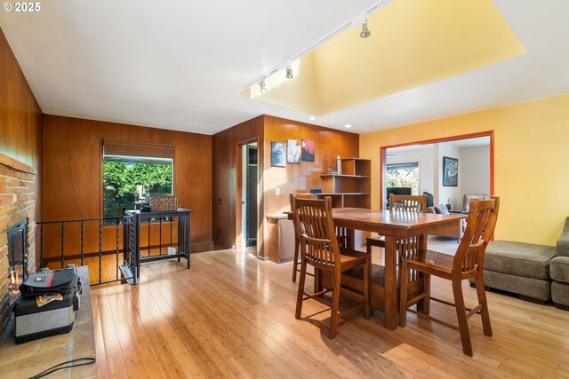 2120 W 23rd Ave, Eugene, OR 97405 - dining space featuring healthy amount of natural light, track lighting, hardwood / wood-style floors, and wood walls