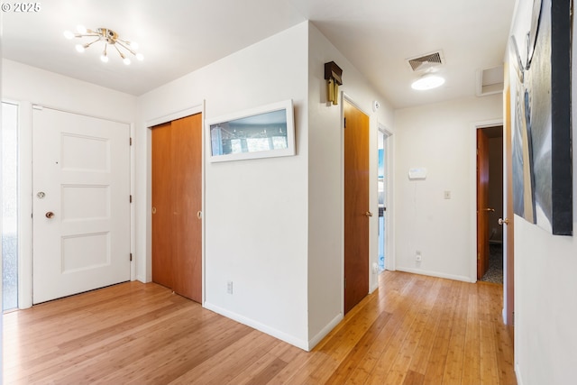 2120 W 23rd Ave, Eugene, OR 97405 - entryway featuring light wood-style floors and a chandelier