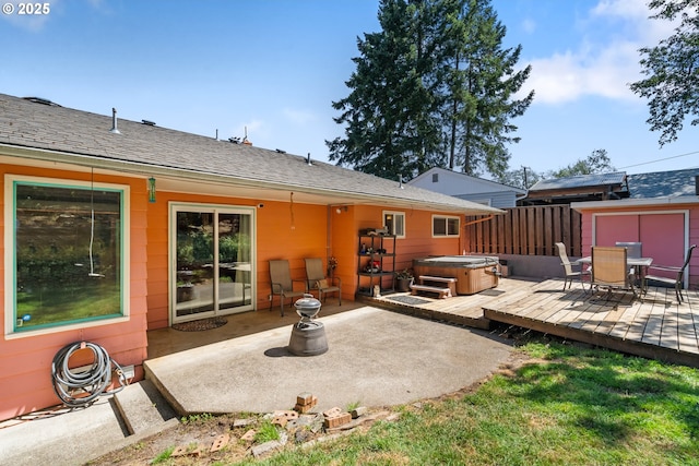 2120 W 23rd Ave, Eugene, OR 97405 - back of property with a hot tub, outdoor dining area, a wooden deck, and a patio