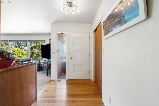 2120 W 23rd Ave, Eugene, OR 97405 - entryway with a chandelier and light wood-type flooring