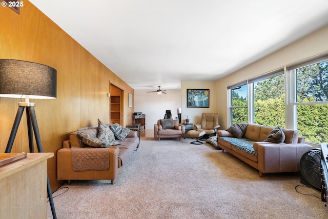 2120 W 23rd Ave, Eugene, OR 97405 - carpeted living room with plenty of natural light, ceiling fan, and wooden walls