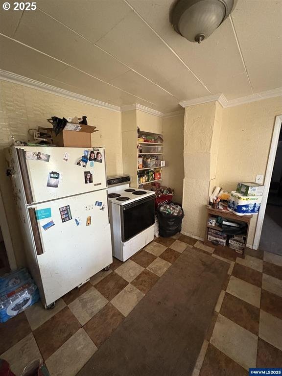 kitchen with white appliances and ornamental molding