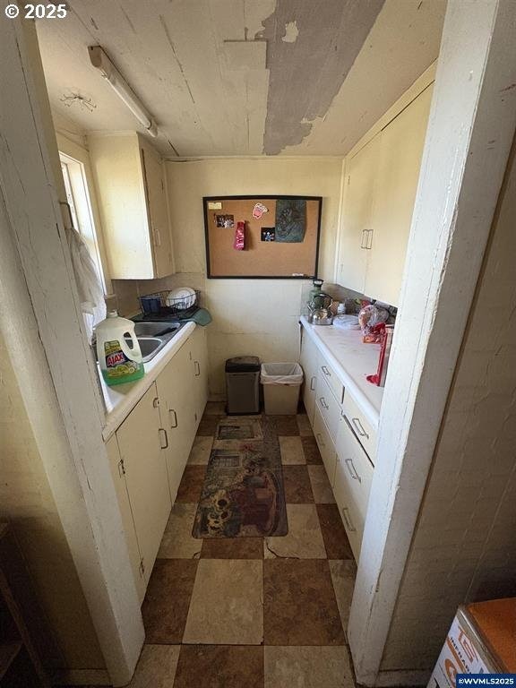 kitchen with sink and white cabinets