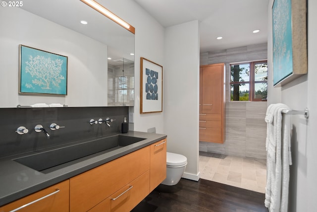 693 Terrace Dr, Lake Oswego, OR 97034 - full bath with wood finished floors, vanity, recessed lighting, a shower, and tile walls