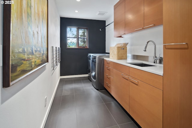 693 Terrace Dr, Lake Oswego, OR 97034 - laundry room featuring washer and clothes dryer, cabinet space, dark tile patterned floors, and recessed lighting