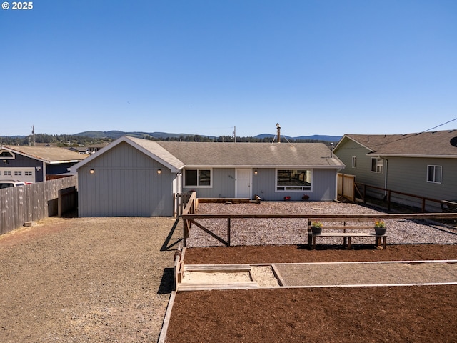 1005 NW Pacific Way, Waldport, OR 97394 - ranch-style home with a fenced backyard and a mountain view