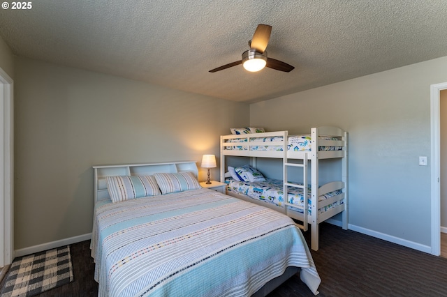 1005 NW Pacific Way, Waldport, OR 97394 - carpeted bedroom with a ceiling fan and a textured ceiling