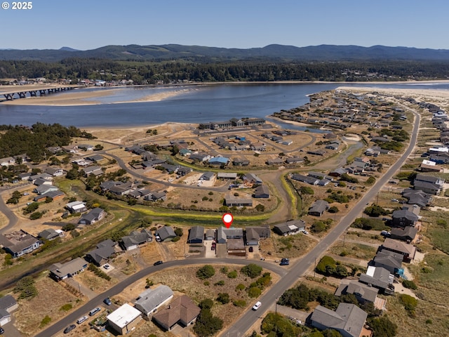 1005 NW Pacific Way, Waldport, OR 97394 - aerial view of property and surrounding area with a water and mountain view