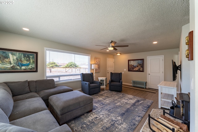 1005 NW Pacific Way, Waldport, OR 97394 - living area with a textured ceiling, a ceiling fan, wood finished floors, and recessed lighting