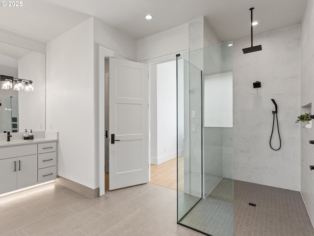 full bath featuring recessed lighting, tile patterned flooring, vanity, a walk in shower, and baseboards