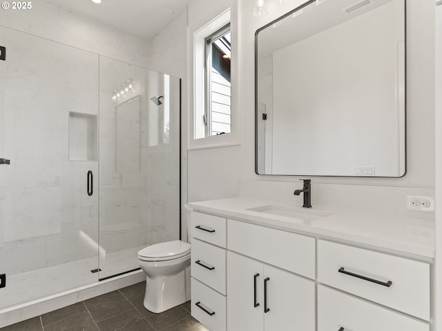 full bathroom with visible vents, a marble finish shower, vanity, and toilet