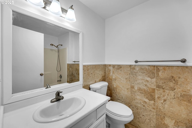 1320 NW Maple Ln, Camas, WA 98607 - full bathroom with toilet, vanity, tile walls, wainscoting, and shower / bathtub combination