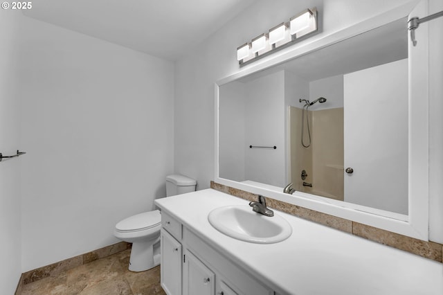 1320 NW Maple Ln, Camas, WA 98607 - full bath featuring toilet, vanity, baseboards, bathtub / shower combination, and stone finish floors