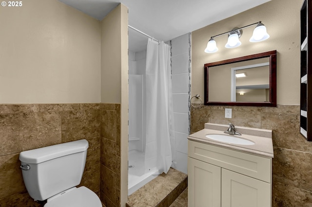1320 NW Maple Ln, Camas, WA 98607 - full bath with tile walls, toilet, vanity, tiled shower, and a wainscoted wall