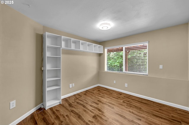 1320 NW Maple Ln, Camas, WA 98607 - spare room featuring baseboards and wood finished floors