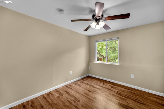 1320 NW Maple Ln, Camas, WA 98607 - empty room featuring baseboards, wood finished floors, a smoke detector, and ceiling fan