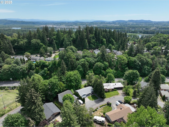 1320 NW Maple Ln, Camas, WA 98607 - aerial view of residential area featuring a mountain backdrop and a heavily wooded area