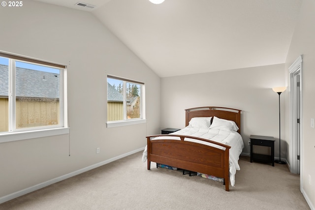 carpeted bedroom featuring vaulted ceiling